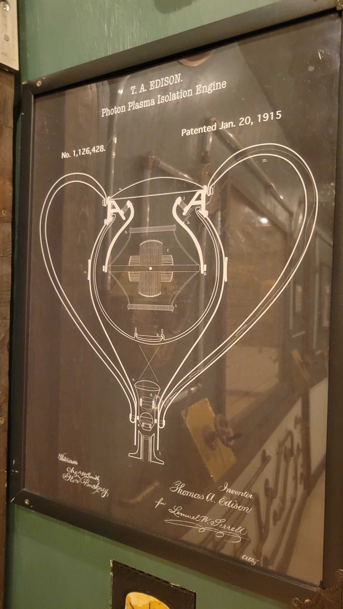 Fictional Edison Jar patent — Photon Plasma Isolation Engine — hung on the lab wall